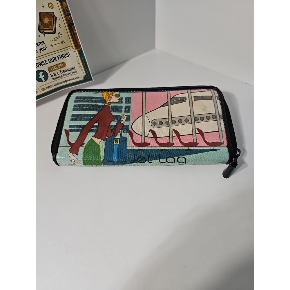 Mary Frances "Jet Lag" design wallet / clutch. It features her signature...